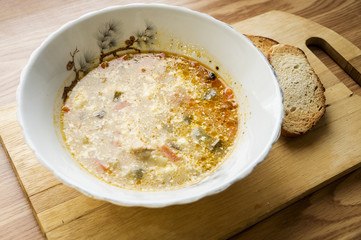 soup with sour cream on a wooden tray