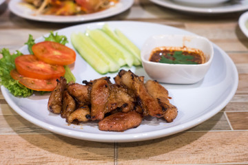 Grilled pork and sauce with salad vegetable .Thai traditional food.selective focus
