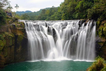 Fototapeta na wymiar Long exposure of Shifen Waterfall on the Keelung River in Pingxi District, New Taipei City, Taiwan