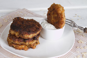 Pancakes oatmeal with cream and ice-cream bowls