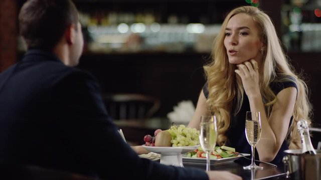 close view of a nice couple dating in restaurant