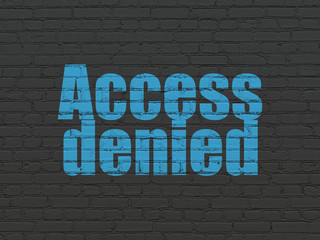 Protection concept: Access Denied on wall background