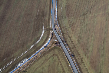 aerial  view of the  road and the harest fields