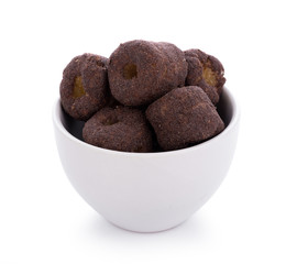Crunchy corn chocolate snacks on a white background