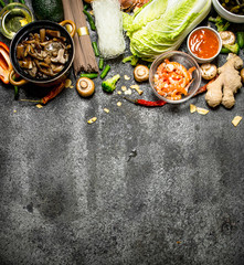 Asian food. A variety of ingredients for cooking Asian food on rustic background.