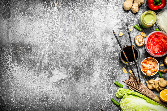 Asian food. Fresh ingredients for cooking Chinese food on a rustic background .