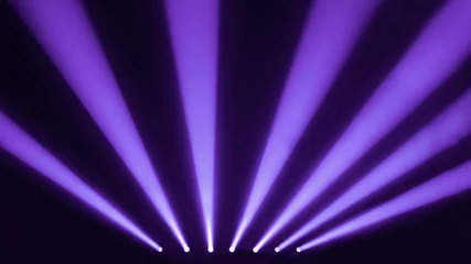 Fototapete Serenity and purple stage spotlights with a smoke © eldi_93