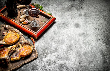 Meat grill. Fried chunks of pork grilled with spices and a bottle of red wine.