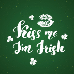 Kiss me, I'm irish. St Patrick's Day greeting card Hand lettering with lips and clovers, Irish holiday brushed calligraphic sign vector illustration.