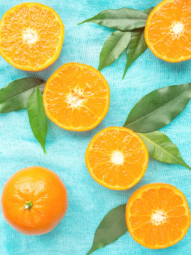 Fresh citrus fruits tangerines, oranges closeup in rustic style
