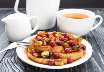 Hot french toasts with caramelized apples, and tea