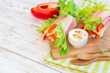 Spring roll with vegetables and white sour cream souce