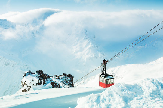 Red Ski Lift Gondola On The Ski Resort In Winter Mountains.