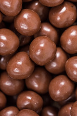 Chocolate round beads marbles sweet cookies macro closeup