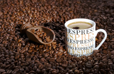 wooden spatula is gaining fresh roasted coffee beans