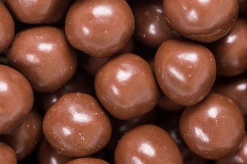 Chocolate round beads marbles sweet cookies macro closeup