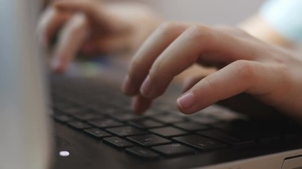 Close-up of children's hands typing on a keyboard - Powered by Adobe