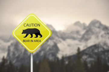 Yellow warning sign board - caution, bear in the area 