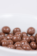 Chocolate round beads marbles sweet cookies macro closeup