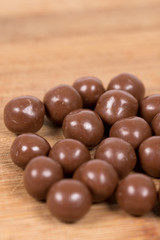 Chocolate round beads marbles sweet cookies macro closeup