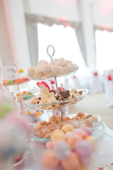 sweet muffins cookies on buffet table
