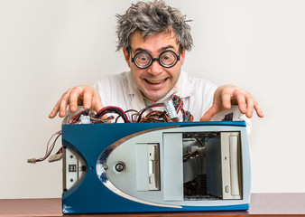 Crazy engineer or scientist repairing computer