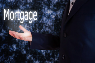 Businessman holding a Mortgage Concept