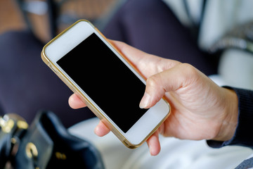 Smartphone in right hand.