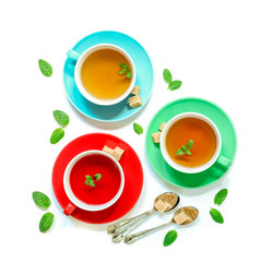 Tea Collection of three different types of tea - mint, hibiscus and herbal tea in cups isolated on white.