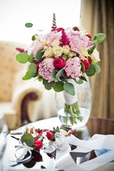 fresh flowers in vases baskets on a table decoration