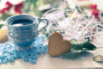 Cup of coffee with cookies on the white boards