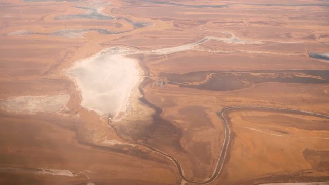 Aerial footage of frozed lakes and rivers in desert area zone