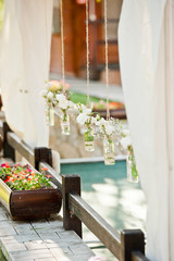 fresh flowers in vases baskets on a table decoration