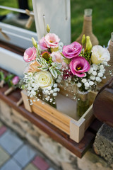 fresh flowers in vases baskets on a table decoration