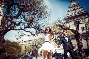 happy and loving couple walking and make photo in the old city