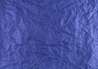 Crumpled paper background vignette.