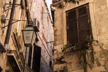 Shutter and lantern of tenement house in Old Town Dubrovnik - obrazy, fototapety, plakaty