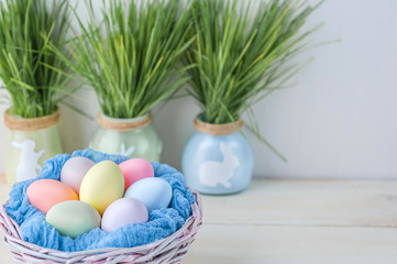 Fototapeta na wymiar Cute creative photo with easter eggs in the nest