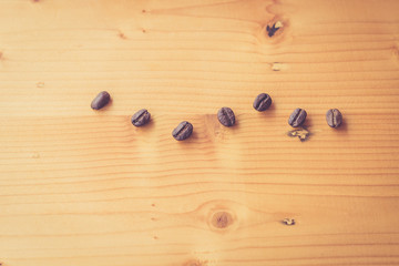 Vintage coffee beans on wooden top view