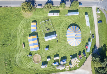 Aerial view of a circus tent and white tigers