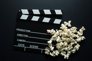 Clapperboard and popcorn.