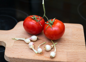 young garlic and a couple tomatoes
