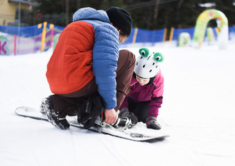  Little girl on snowboard