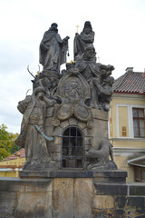 Obraz premium Prague, Czech Republic - October 8, 2015 : Statue decoration of Charles Bridge in Vltava river. Unfiltered. Famous tourist and traveler routs