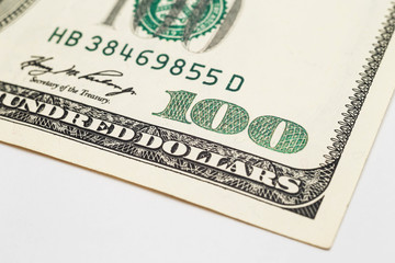 Close up of part hundred dollars bill.