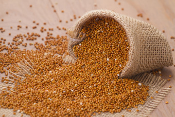 Millet on wooden background