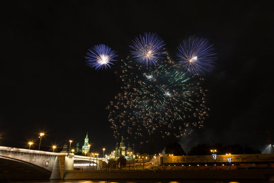 Fireworks over the Moscow Kremlin at night. View of the Moscow River, Russia