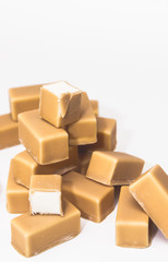 Sweet marshmallow covered with chocolate isolated on white background.