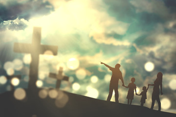 Family walk towards crucifix symbols