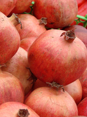 pomegranates in the market for sale as a background close-up. Selective focus